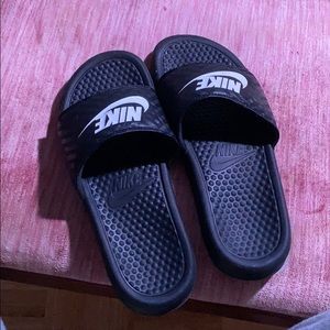 Slightly worn Nike slides